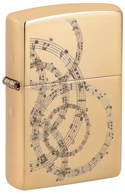 Gold Zippo lighter with intricate music sheet design P1