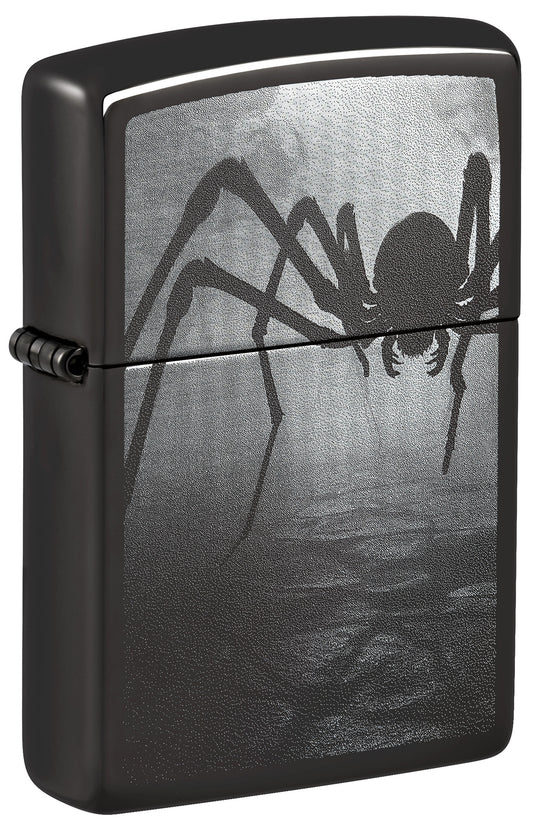 Black Zippo lighter with spider design on a dark background P1