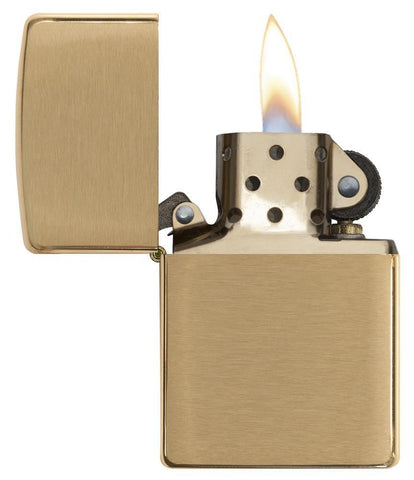 Armor® Brushed Brass Windproof Lighter with its lid open and lit