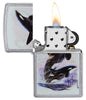 Zippo lighter front view chrome opened and lit with coloured illustration of two killer whales drawn by Guy Harvey
