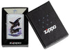 Zippo lighter front view chrome plated with coloured illustration of two killer whales drawn by Guy Harvey in open box