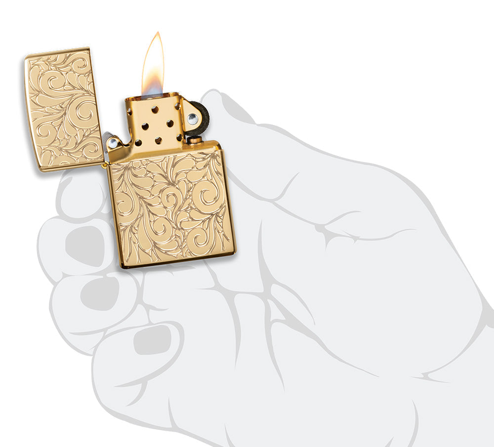 Zippo Lighter Front View Armor® highly polished brass opened and lit with deeply engraved squiggly lines in stylized hand