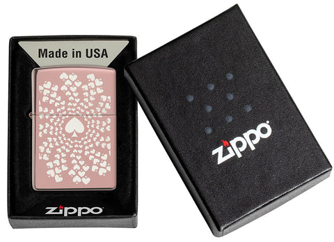 Zippo lighter high gloss rose gold with many circular aces on chrome background in opened gift box