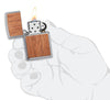 WOODCHUCK USA Mahogany Brushed Chrome windproof lighter in hand and lit