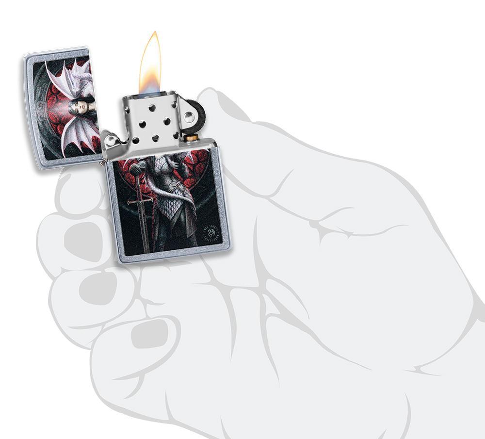 Anne Stokes Dragon Warrior Street Chrome windproof lighter lit in hand