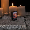 Lifestyle image of Anne Stokes Fire Breathing Dragon Lighter standing on cobblestone with lit candles in the background