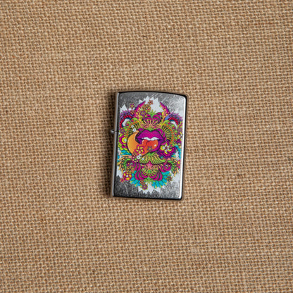 Lifestyle image of Psychedelic Lip Design Street Chrome Lighter laying on hemp fabric