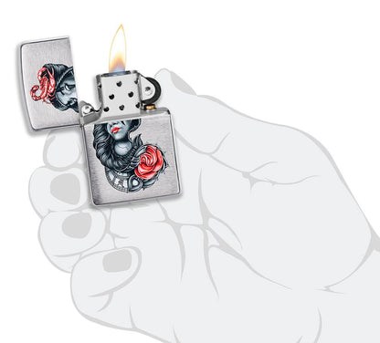 stylised Tattoo Design Brushed Chrome Windproof Lighter lit in hand