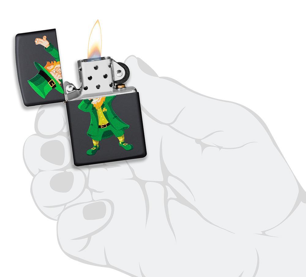 Dabbing Leprechaun Black Matte Windproof Lighter in hand and lit