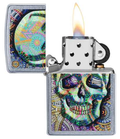 Geometric Skull Design Street Chrome Windproof Lighter with its lid open and lit