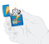 Zippo lighter high gloss blue in retro style with many colourful triangles and logo opened with flame in stylised hand