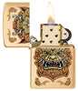 Front view of the open Zippo windproof lighter Foo Dog Design, with flame, showing an imperial golden lions in the style of chinese art.