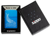 Zippo Lighter Whale Design shiny light blue in its open packaging with an engraved whale with round waves
